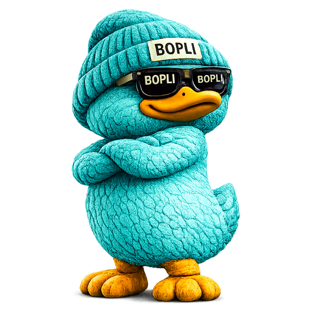 Bopli, a teal plush duck in a beanie and sunglasses, arms crossed